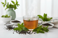 mint tea with refreshing background and loose leaf gunpowder green tea, peppermint, and spearmint.